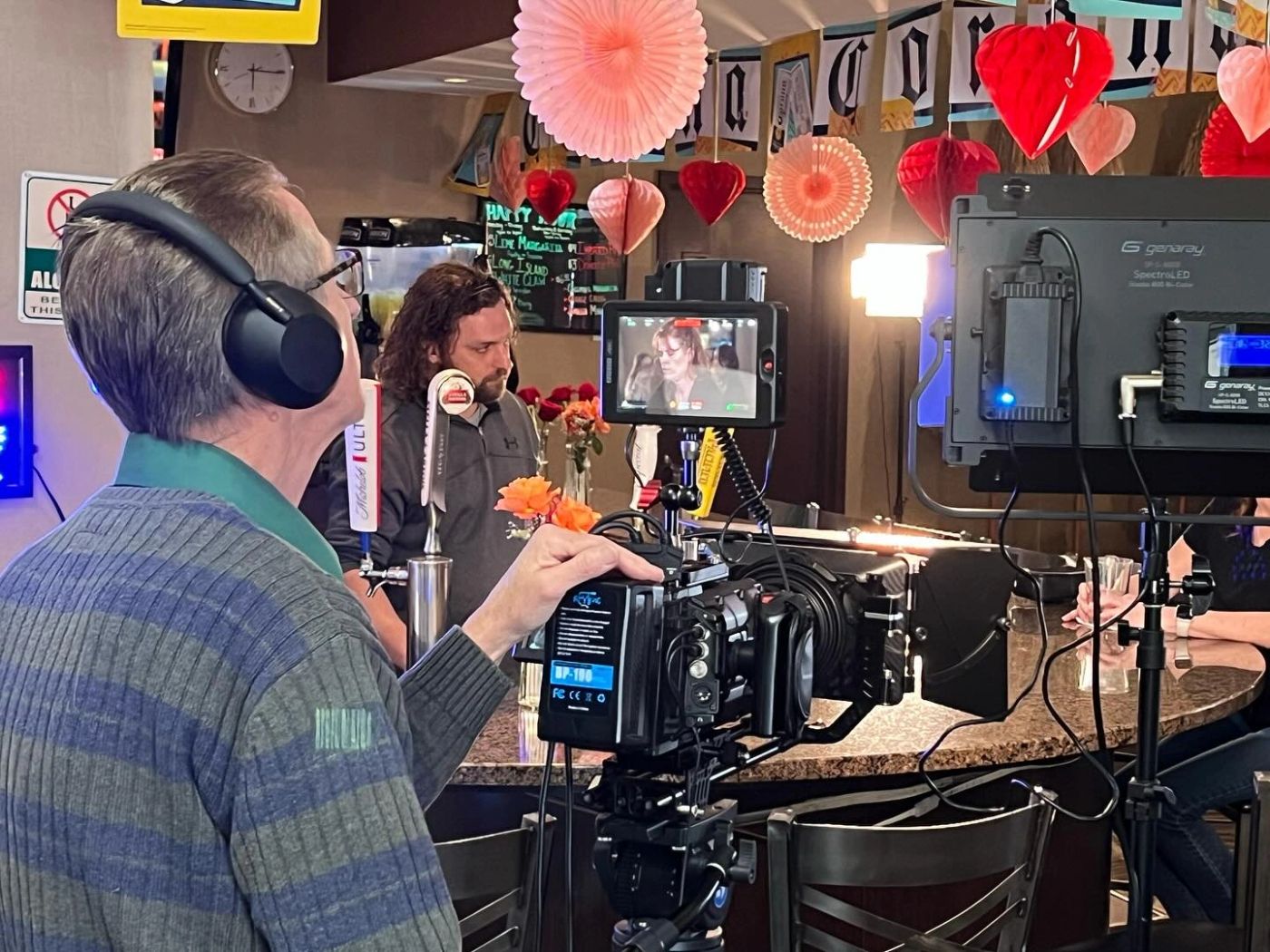 Film crew working with a camera on set
